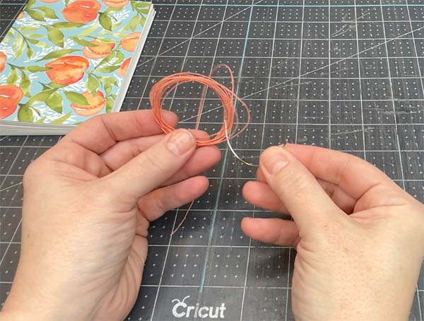 how to thread a curved bookbinding needle